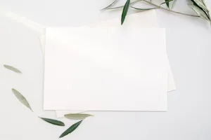 White Printer Paper With Green Leaves Wallpaper