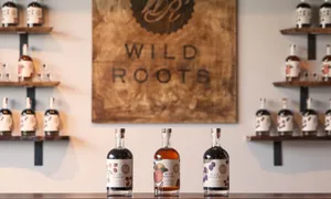 Wild Roots Logo And Vodka Wallpaper