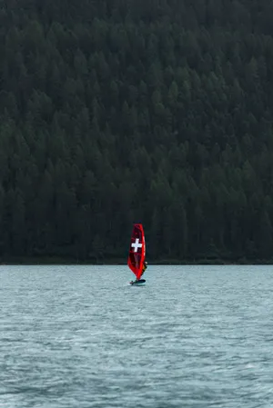 Windsurfing Sail With A Cross Wallpaper