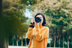Woman Holding Dslr Camera Wallpaper