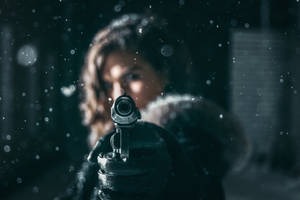 Woman Holding Gun Wallpaper