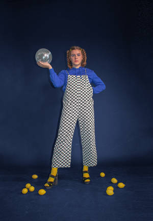 Woman In Checkered Jumpsuit Wallpaper