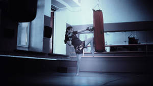 Woman Practicing Muay Thai Wallpaper