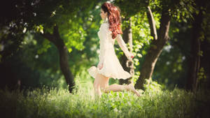 Woman Running In Forest Wallpaper