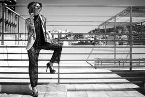 Woman Sitting On Fence While Holding Cigarette Wallpaper