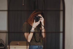 Woman Taking Photo Using Dslr Camera Wallpaper