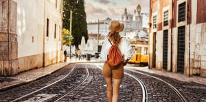 Woman Traveller In Lisbon Wallpaper