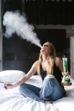 Woman Using A Bong With A Joint Wallpaper