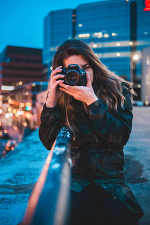 Woman Using Camera Wallpaper