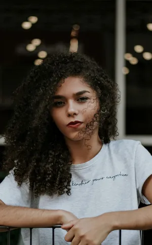 Woman With Curly Hair White Shirt Wallpaper