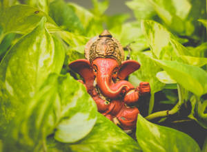 Wooden Ganesh Chaturthi Figurine Wallpaper