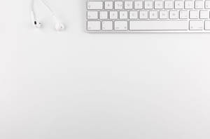 Work Table In Cute White Aesthetic Wallpaper