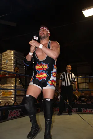 Wrestler_with_ Microphone_in_ Ring.jpg Wallpaper