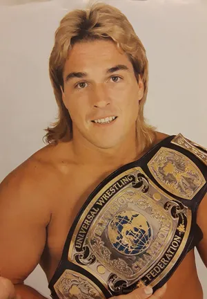 Wrestlerwith Championship Belt Wallpaper