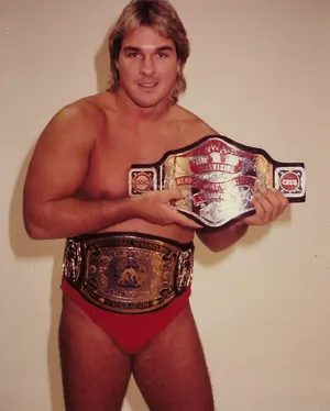 Wrestlerwith Championship Belts Wallpaper