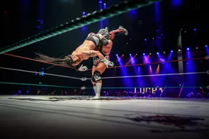 Wrestling Move Execution In Ring Wallpaper