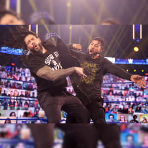 Wwe's Jey Uso In Action Against Roman Reigns Wallpaper