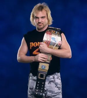 Wwe Wrestler Spike Dudley Triumphantly Holding The European Championship Belt. Wallpaper