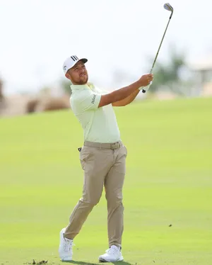 Xander Schauffele Full Body Golf Swing Wallpaper