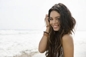 Young Vanessa Hudgens At A Beach Wallpaper