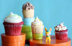 Yummy Cream-topped Cupcakes Wallpaper