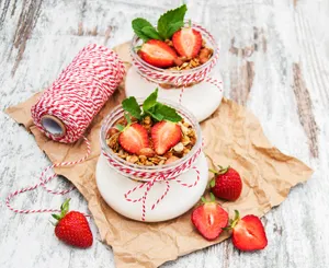 Yummy Yogurt With Granola And Strawberries Wallpaper