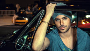 Zac Efron Enjoys A Drive In A Luxurious Car Wallpaper