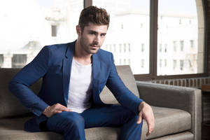 Zac Efron Looking Dashing In Blue Suit Wallpaper