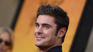 Zac Efron, The Happy-go-lucky Hollywood Actor Wallpaper