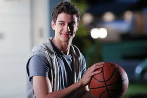 Zapped Adam Holding A Basketball Wallpaper