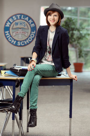 Zapped Rachel Sitting On Table Wallpaper