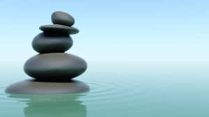 Zen Desktop Stone Stack On Water Surface Wallpaper