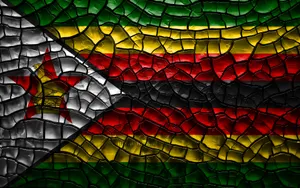 Zimbabwe's Flag On Cracked Soil Wallpaper