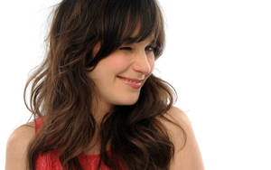 Zooey Deschanel Winking White Background Wallpaper